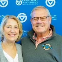 a couple poses for a picture